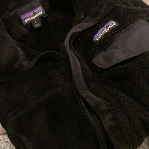 Patagonia black full zip fleece with pockets and chest pocket. Size small.